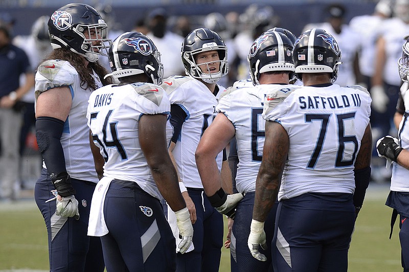 AP photo by Mark Zaleski / Tennessee Titans quarterback Ryan Tannehill, center, huddles with his teammates in the first half of an AFC South matchup with the Jacksonville Jaguars on Sept. 20 in Nashville.