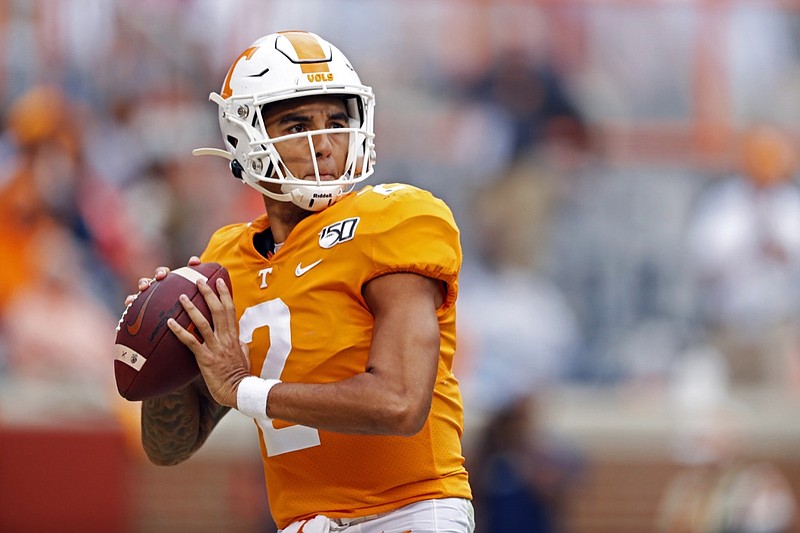 FILE - In this Oct. 26, 2019, file photo, Tennessee quarterback Jarrett Guarantano looks for a receiver during an NCAA college football game against South Carolina in Knoxville, Tenn. Guarantano and the 16th-ranked Tennessee Volunteers are about to find out how much having the same offensive coordinator for consecutive seasons can help a quarterback. (AP Photo/Wade Payne, File)