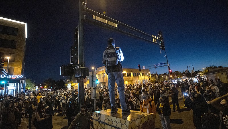 Protesters block an intersection in Minneapolis on Wednesday, Oct. 7, 2020, after Derek Chauvin, the former Minneapolis police officer charged with murder in the death of George Floyd, posted bail and was released from prison. (Carlos Gonzalez/Star Tribune via AP)