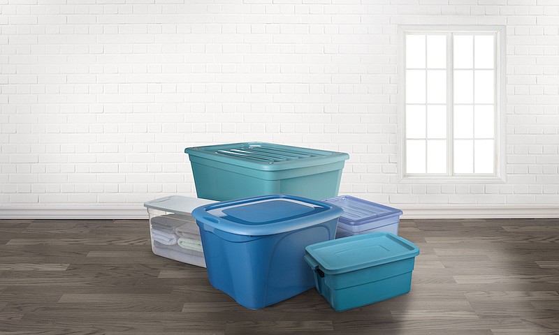 Storage totes boxes in an empty room with a window. / Photo credit: Getty Images/iStock/NAKphotos