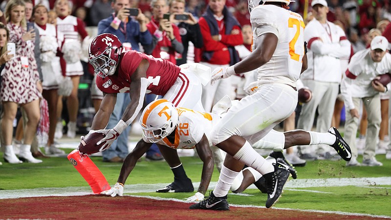 Crimson Tide photos / Tennessee safety Theo Jackson, center, and linebacker Quavaris Crouch give chase last October as Alabama's Brian Robinson scores a touchdown in the Crimson Tide's 35-13 victory. The defeat marked the 33rd in a row for the Volunteers against a top-10 team.