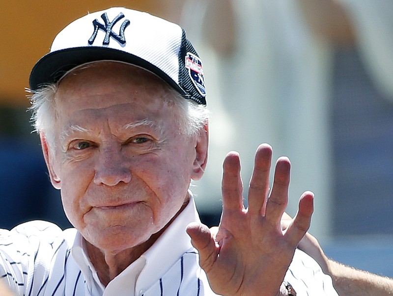 AP photo by Kathy Willens / Former New York Yankees pitcher Whitey Ford waves to fans from outside the dugout at the team's annual Old Timers Day game on June 12, 2016.