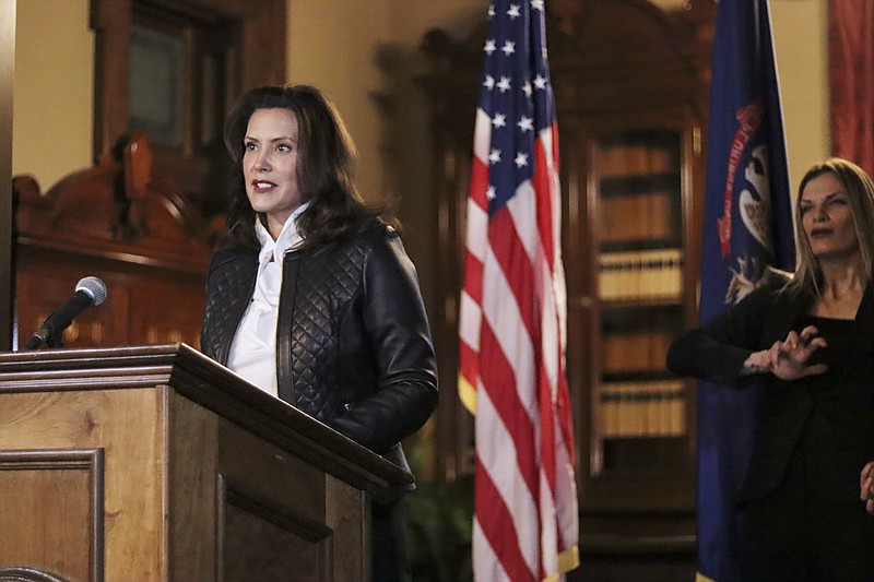 Photo from the Michigan Office of the Governor via The Associated POress / Michigan Gov. Gretchen Whitmer addresses the state during a speech in Lansing, Michigan, on Thursday, Oct. 8, 2020. The governor delivered remarks after the Michigan Attorney General, Michigan State Police, U.S. Department of Justice and FBI announced state and federal charges against 13 members of two militia groups who were preparing to kidnap and possibly kill the governor.