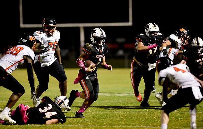 Staff Photo by Robin Rudd / Meigs County's Logan Carroll (2) finds a hole in the Pirate defense.  The South Pittsburg Pirates visited the Meigs County Tigers at the school's Jewell Field on Friday, October 9, 2020, in Decatur, Tenn.