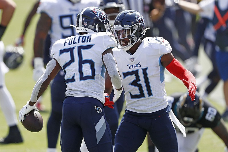 AP photo by Wade Payne / Tennessee Titans cornerback Kristian Fulton is congratulated by free safety Kevin Byard after Fulton intercepted a pass against the Jacksonville Jaguars on Sept. 20 in Nashville.