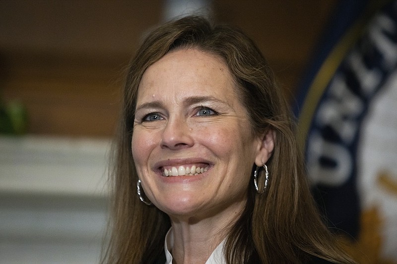In this Oct. 1, 2020, photo, Supreme Court nominee Judge Amy Coney Barrett, meets with Sen. Roger Wicker, R-Miss., at the Capitol in Washington. Confirmation hearings begin Monday for President Donald Trump's Supreme Court nominee, Amy Coney Barrett. If confirmed, the 48-year-old appeals court judge would fill the seat of liberal Justice Ruth Bader Ginsburg, who died last month. (Graeme Jennings/Pool via AP)


