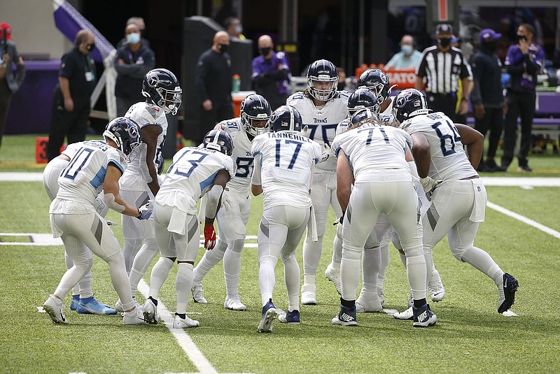 AP photo by Bruce Kluckhohn / Tennessee Titans quarterback Ryan Tannehill (17) calls a play in the huddle during a game against the Minnesota Vikings on Sept. 27 in Minneapolis. If the Titans are able to play Tuesday's home game against the Buffalo Bills as planned, it will be their first since that 31-30 win to improve to 3-0.
