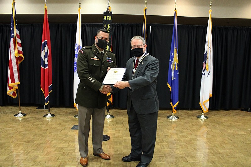 Photo contributed by Brian Dunn / Col. Brent Clemmer, U.S. Army, Commander — 7th ROTC Brigade, left, is shown presenting the ROTC Hall of Fame certificate to Lt. Col. Greg Lane, U.S. Army Reserve (Retired), APSU Army ROTC cadet success coordinator.