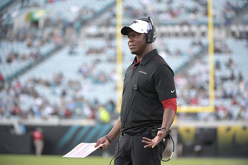 FILE - In this Aug. 19, 2019, file photo, Atlanta Falcons then-assistant head coach/passing game coordinator Raheem Morris watches from the sideline during the first half of a preseason NFL football game against the Jacksonville Jaguars, in Jacksonville, Fla. The Atlanta Falcons have named defensive coordinator Raheem Morris interim head coach after firing Dan Quinn.  (AP Photo/Phelan M. Ebenhack, File)