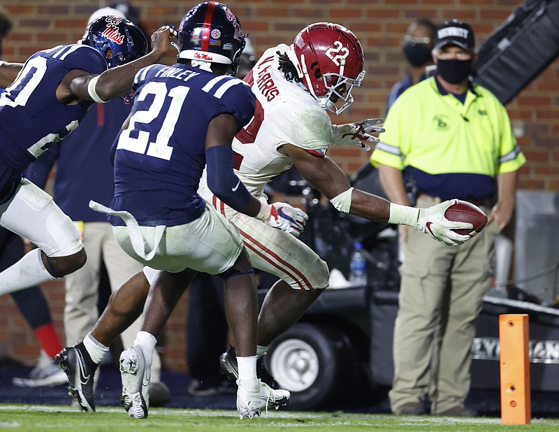 Alabama photo by Kent Gidley / Alabama senior running back Najee Harris reaches the ball across the goal line for one of his five touchdowns last Saturday night at Ole Miss.
