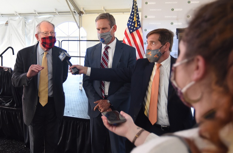 Staff Photo by Matt Hamilton / Congressman Chuck Fleischmann, right, holds a microphone for the media as U.S. Senator Lamar Alexander speaks to the media and Tennessee Governor Bill Lee looks on at the former site for the K-25 uranium enrichment facility in Oak Ridge, Tenn. on Tuesday, Oct. 13, 2020.