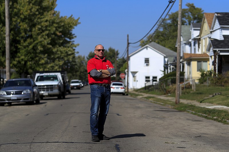 Gary Zaremba stands for a portrait outside of a house he oversees, Wednesday, Oct. 7, 2020, in Dayton, Ohio. Seven months after the pandemic began, landlords face an even more uncertain future. Zaremba, who owns and and manages 350 apartment units spread out over 100 buildings in Dayton, Ohio, said he has been working with struggling tenants and directs them to social service agencies for additional help. (AP Photo/Aaron Doster)