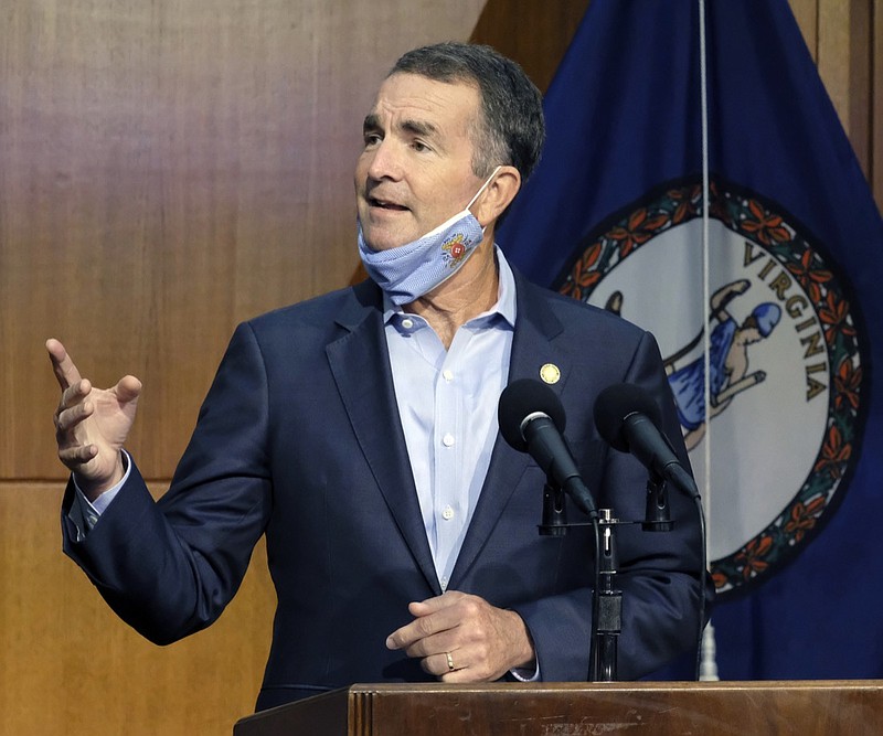 FILE - In this Sept. 1, 2020, file photo, Virginia Gov. Ralph Northam answers a reporter's question during a news briefing in Richmond, Va. Members of anti-government paramilitary groups discussed kidnapping Virginia's governor during a June meeting in Ohio, an FBI agent testified Tuesday, Oct. 13 during a court hearing in Michigan. Special Agent Richard Trask was part of the investigation that led to six men being arrested and charged last week with plotting to kidnap Michigan Gov. Gretchen Whitmer. (Bob Brown/Richmond Times-Dispatch via AP, File)