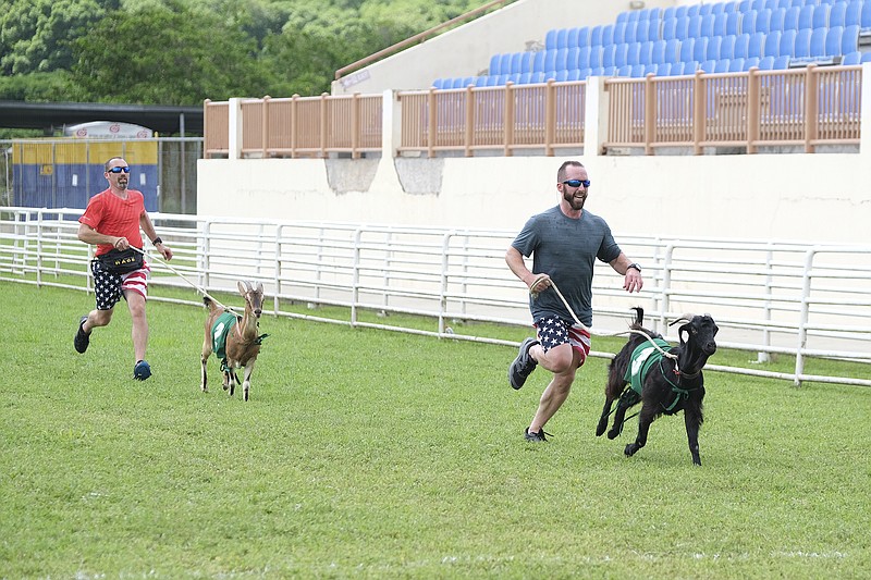 Contributed Photo by Timothy Kuratek/CBS / In the premiere episode, "One Million Miles," Nathan Worthington, left, and Cody Buell of Dayton, Tenn., race goats in the Buccoo Integrated Facility in Tobago as their final challenge in the 32nd season of "The Amazing Race."