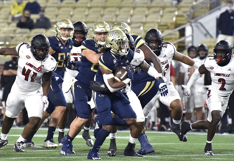 AP photo by Hyosub Shin / Georgia Tech running back Jahmyr Gibbs breaks away for a touchdown against Louisville during the first half of last Friday's game in Atlanta. Gibbs, a freshman who was starring for Dalton High School at this time last year, helped lead the Jackets to a 46-27 win over the Cardinals.