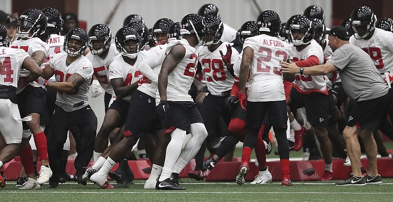 AP file photo by Curtis Compton / The Atlanta Falcons are working virtually until they are allowed to return to their headquarters in Flowery Branch, Ga.