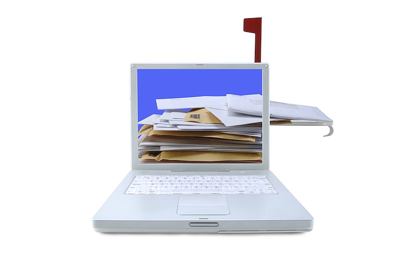 Laptop computer with mailbox flag and letters. / Getty Images/iStock/pixhook