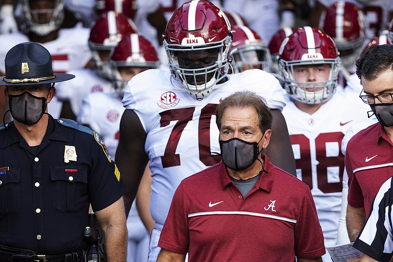 AP file photo / In this Sept. 26, 2020, file photo, Alabama Coach Nick Saban leads his team to the field before an NCAA college football game against Missouri. Saban and athletic director Greg Byrne have tested positive for COVID-19.