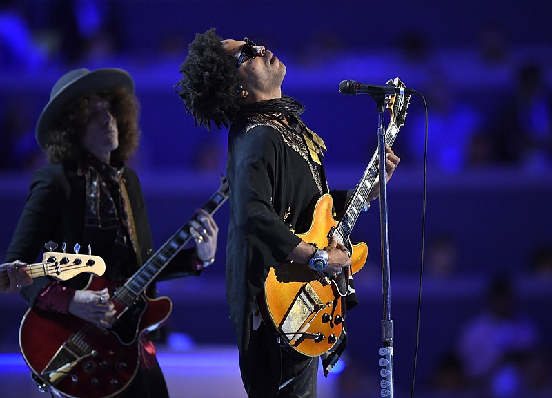 Singer Lenny Kravitz performs during the Democratic National Convention in Philadelphia on July 27, 2016. In a new memoir, "Let Love Rule," Kravitz explores his childhood and ends with him on the verge of stardom and deeply in love with actress Lisa Bonet. (AP Photo/Mark J. Terrill, File)