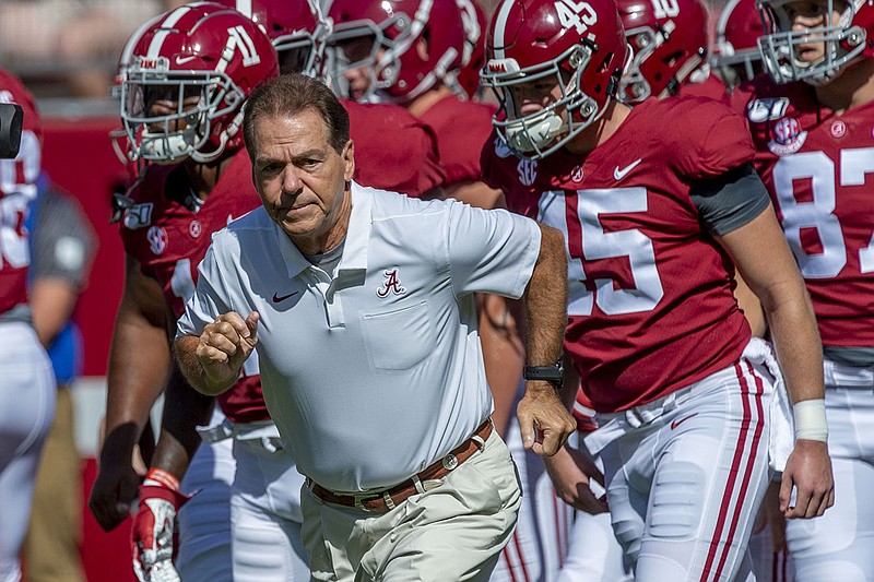 AP photo by Vasha Hunt / Alabama football coach Nick Saban leads his team onto the field before a home game against Ole Miss on Sept. 21, 2019.