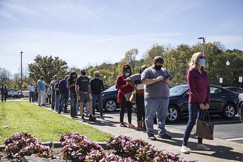 Staff photo by Troy Stolt / Collegedale residents line up at town hall for early voting for the November 3 election on Saturday, Oct. 17, 2020 in Collegedale , Tenn.