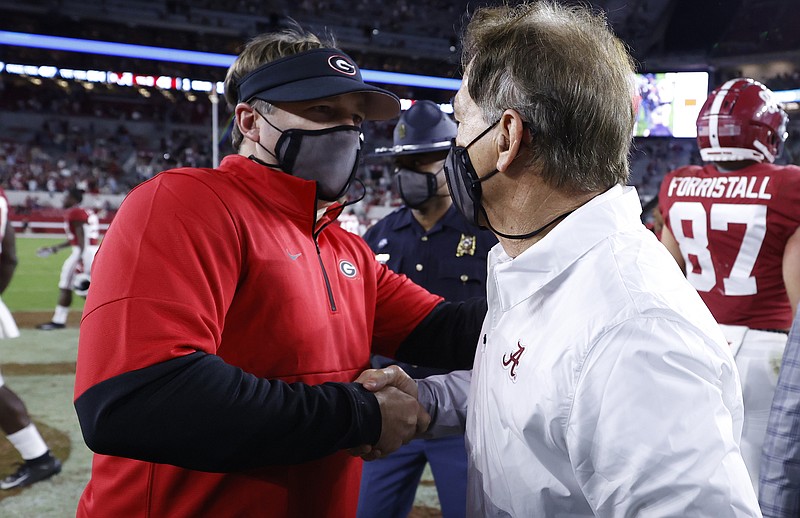 Crimson Tide photos / Georgia football coach Kirby Smart congratulates Alabama counterpart Nick Saban after the No. 2 Crimson Tide's 41-24 victory over the No. 3 Bulldogs in Bryant-Denny Stadium late Saturday.