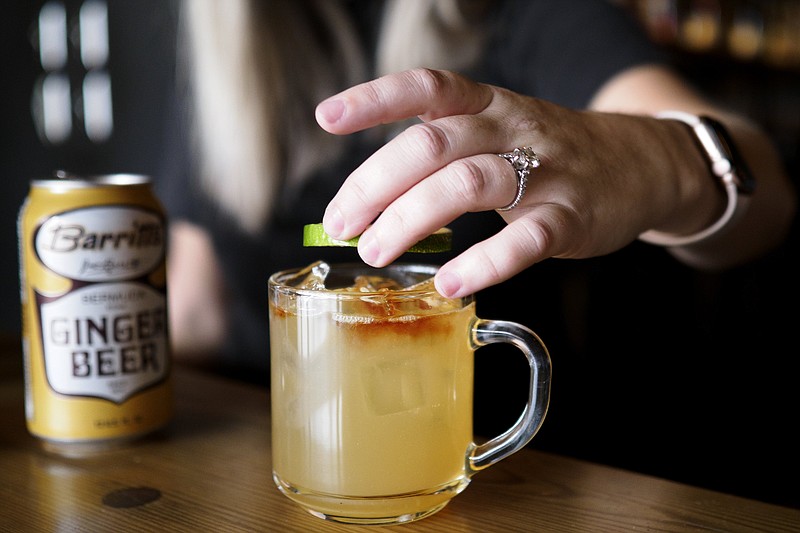 Staff photo by C.B. Schmelter / Chattanooga Whiskey Bar Manager Katelin Rutter makes a Chattanooga Mule at the Chattanooga Whiskey Experimental Distillery on Friday, Sept. 18, 2020 in Chattanooga, Tenn.