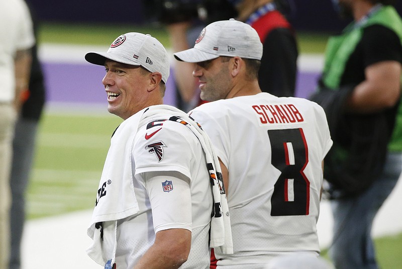 Atlanta Falcons quarterback Matt Ryan, left, laughs on the sideline during the second half of an NFL football game against the Minnesota Vikings, Sunday, Oct. 18, 2020, in Minneapolis. The Falcons won 40-23. (AP Photo/Bruce Kluckhohn)