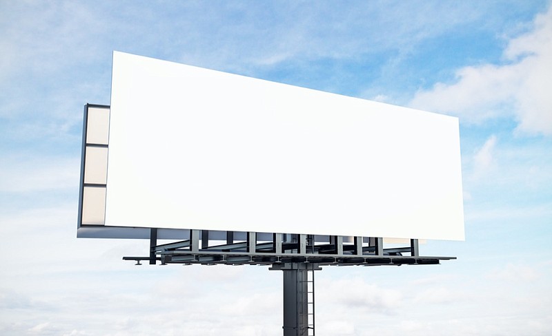 Blank white billboard on blue sky and clouds background. Commercial and ad concept. Mock up, 3D Rendering billboard tile / Getty Images
