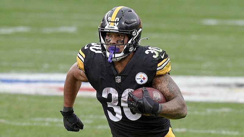 Pittsburgh Steelers running back James Conner (30) runs the ball against the Cleveland Browns during the second half of an NFL football game, Sunday, Oct. 18, 2020, in Pittsburgh. (AP Photo/Don Wright)