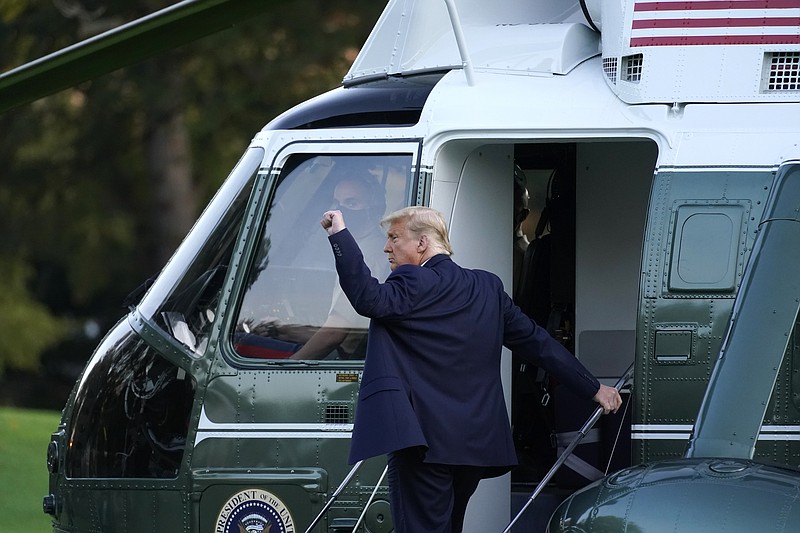 President Donald Trump boards Marine One at the White House in Washington, Tuesday, Oct. 20, 2020, for a short trip to Andrews Air Force Base, Md., and then on to Erie, Pa. for a campaign rally. (AP Photo/Andrew Harnik)