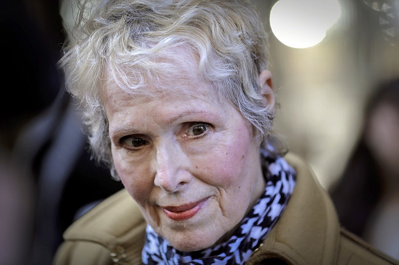 FILE - In this March 4, 2020, photo, E. Jean Carroll talks to reporters outside a courthouse in New York. The U.S. Justice Department is seeking to take over President Donald Trump's defense in a defamation lawsuit brought by Carroll, who accused the president of raping her in a New York luxury department store in the mid-1990s. Federal lawyers asked a court Tuesday, Sept. 8, 2020, to allow a legal move that could put the American people on the hook for any money she might be awarded. She says the president's comments, including that she was "totally lying" to sell a memoir, besmirched her character and harmed her career when he denied the rape allegations in 2019. (AP Photo/Seth Wenig, File)