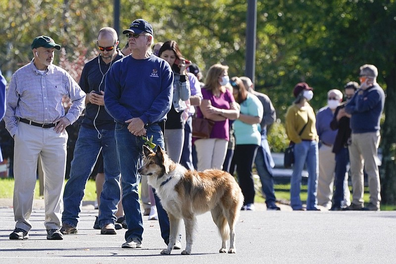 People wait in line to vote at the Brentwood Library on the first day of Tennessee's early voting Wednesday, Oct. 14, 2020, in Brentwood, Tenn. The early, in-person voting period runs Monday through Saturday until Thursday, Oct. 29. (AP Photo/Mark Humphrey)