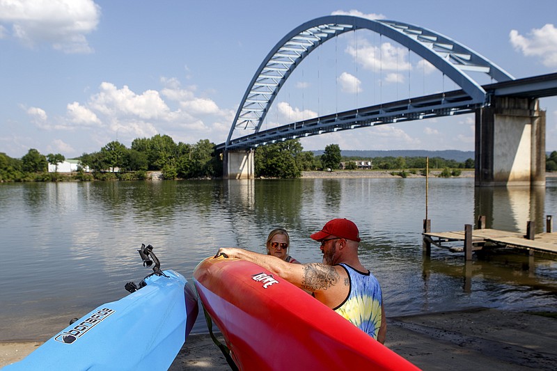 Jennifer and Shawn Siewert prepare to unload kayaks at a boat ramp on the Tennessee River, near the Shelby Rhinehart Bridge on Friday, May 24, 2019 in South Pittsburg, Tenn. The Siewerts planned to make a day of their kayaking trip, bringing food with them and fishing. They are from Steele, Ala.