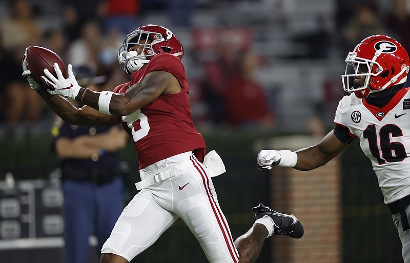Crimson Tide photos / Alabama receiver John Metchie III hauls in a 40-yard touchdown reception to open up the scoring during last Saturday's 41-24 win over Georgia.
