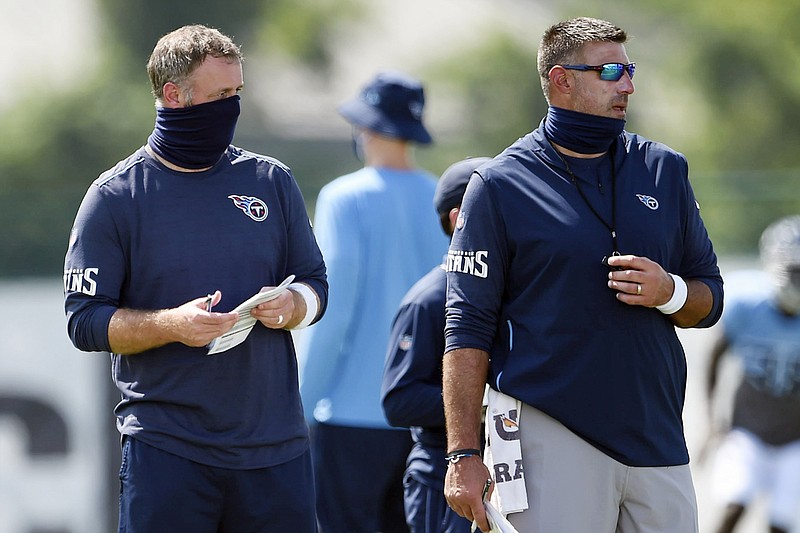 AP photo by George Walker IV / Tennessee Titans outside linebackers coach Shane Bowen, left, and head coach Mike Vrabel watch practice on Aug. 24 in Nashville.