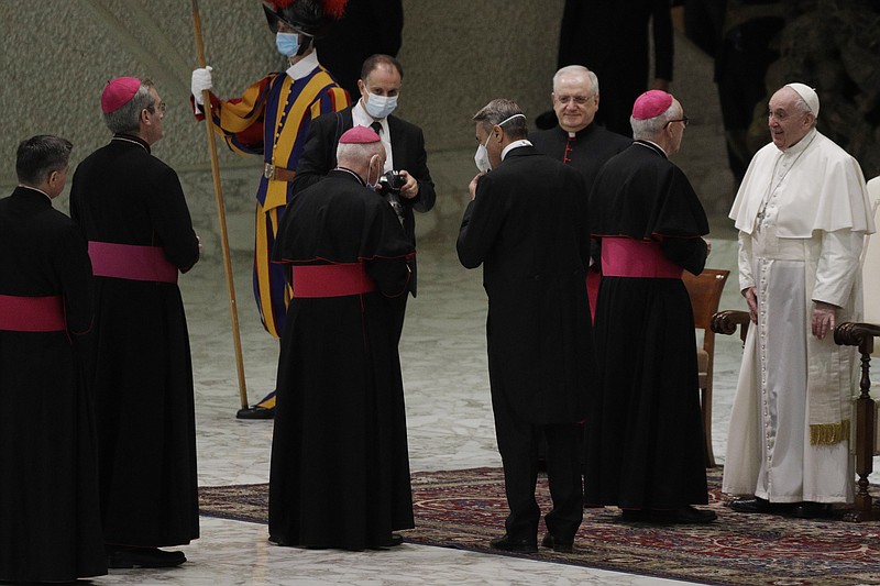 Pope Francis, right, greets bishops at the end of his weekly general audience in the Paul VI hall at the Vatican, Wednesday, Oct. 21, 2020. Pope Francis endorsed same-sex civil unions for the first time as pope while being interviewed for the feature-length documentary "Francesco," which premiered Wednesday at the Rome Film Festival. (AP Photo/Gregorio Borgia)