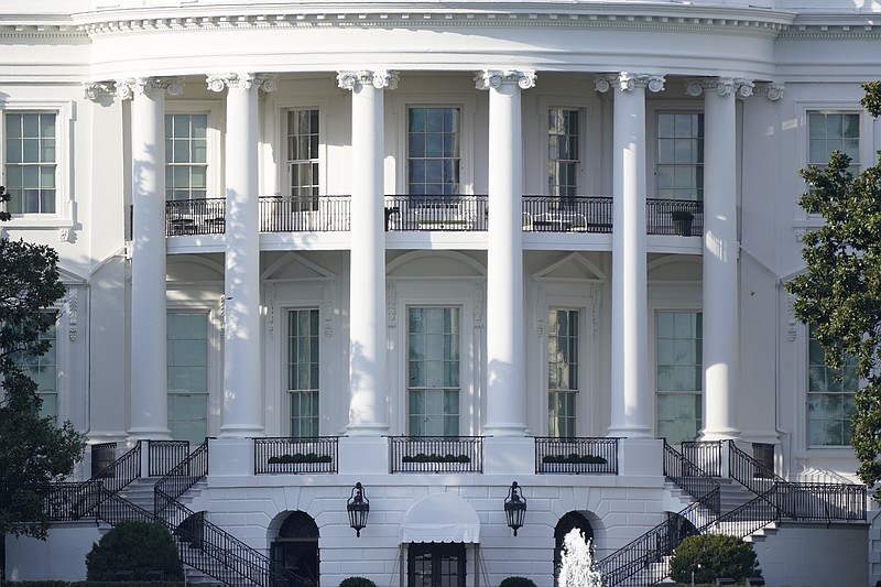 In this Oct. 5, 2020 file photo, the White House is shown Monday afternoon, Oct. 5, 2020, in Washington. President Donald Trump and Democratic rival Joe Biden's campaigns are assembling armies of powerful lawyers as they prepare for the possibility that the race for the White House is decided not at the ballot box but in court. (AP Photo/J. Scott Applewhite)