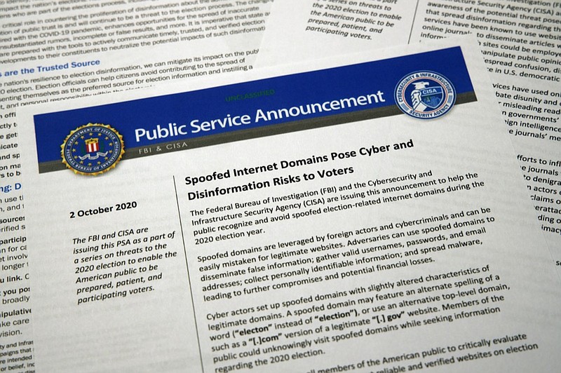 FILE - In this Oct. 6, 2020, file photo, a public service announcement from the FBI and the Department of Homeland Security cybersecurity agency. As President Donald Trump sows doubts about the election, an obscure government agency he created is working behind the scenes to inspire confidence in the vote amid unprecedented challenges. The Cybersecurity and Infrastructure Agency, which Trump signed into existence in 2018, is working with other parts of the government to safeguard an election in the middle of a pandemic. (AP Photo/Jon Elswick, File)


