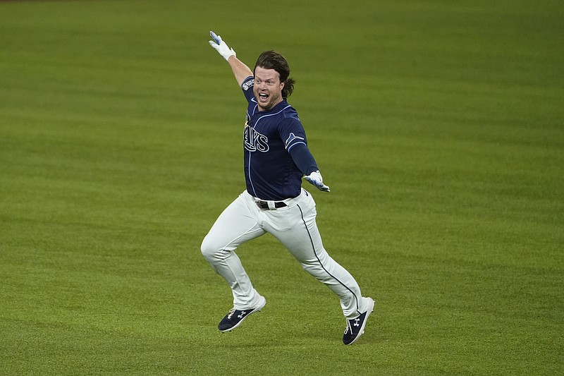 AP photo by Tony Gutierrez / Brett Phillips celebrates after delivering the winning hit for the Tampa Bay Rays in their 8-7 victory against the Los Angeles Dodgers in Game 4 of the World Series on Saturday night in Arlington, Texas.