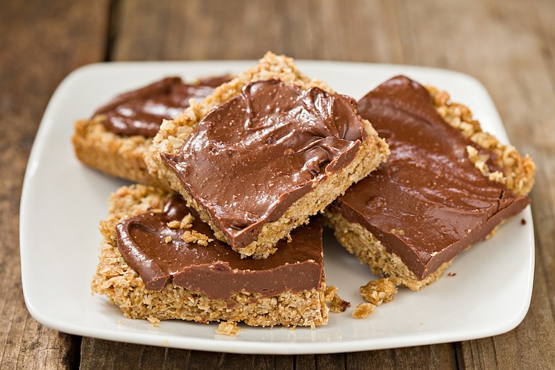 Freshly baked Peanut Butter Oatmeal bars frosted with creamy chocolate. / Getty Images/iStock/DebbiSmirnoff