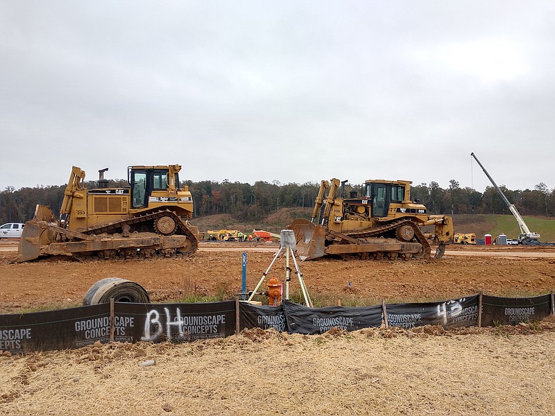 Staff photo by Mike Pare / Heavy equipment and workers ready a site at Spring Branch Industrial Park in Bradley County for an automotive parts plant.