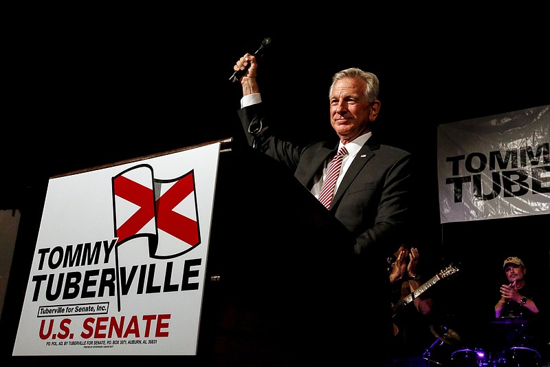 In this Tuesday, July 14, 2020, file photo, former Auburn coach, Tommy Tuberville, speaks to supporters after he defeated Senator Jeff Sessions in the runoff election in Montgomery, Ala. U.S. Sen. Doug Jones is outspending Tuberville in the home stretch of Alabama's Senate race. (AP Photo/Butch Dill, File)