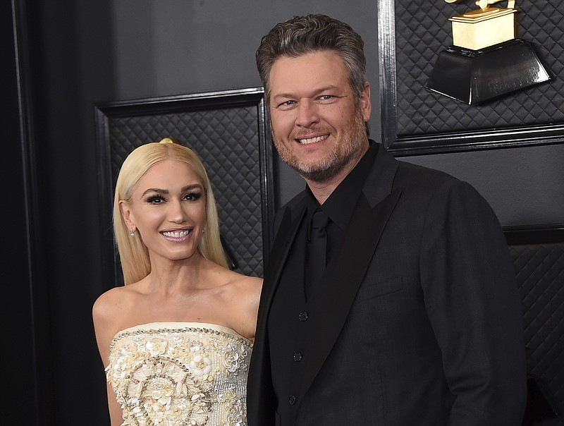 Gwen Stefani, left, and Blake Shelton arrive at the 62nd annual Grammy Awards in Los Angeles on Jan. 26, 2020. Shelton and Stefani posted a picture on Tuesday announcing their engagement.A representative for Shelton confirmed the couple recently got engaged while in Oklahoma, where Shelton lives. The two stars met as judges on the singing competition show years ago. (Photo by Jordan Strauss/Invision/AP, File)