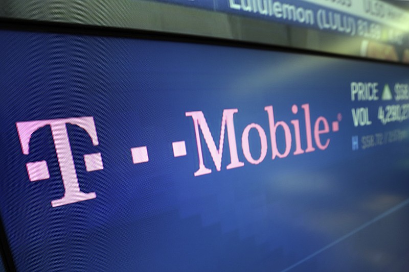 The T-Mobile logo appears on a screen at the Nasdaq MarketSite in New York.