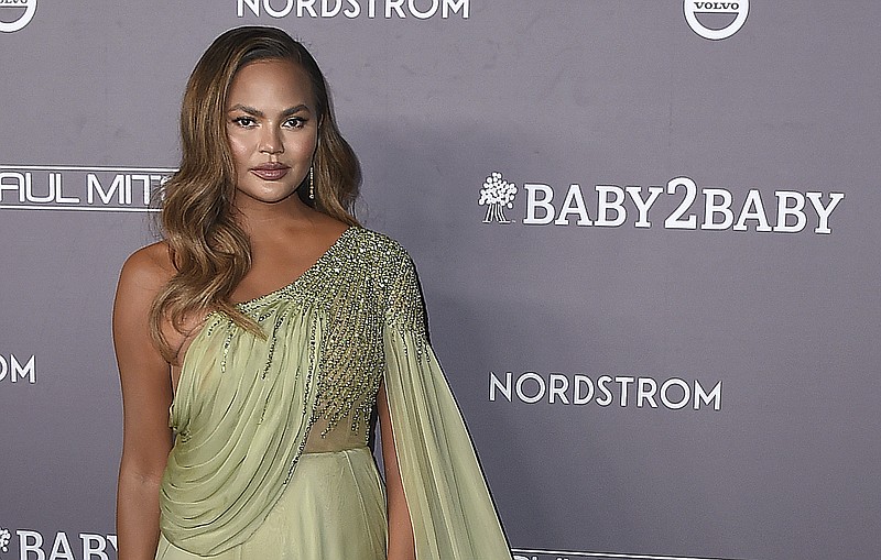 Chrissy Teigen arrives at the Baby2Baby Gala on Nov. 9, 2019, in Culver City, Calif. Teigen has written a heartfelt message about the recent loss of her third child with husband John Legend. Teigen delivered a lengthy essay in a Medium post Tuesday, Oct. 27, 2020. It's her first public response since she and Legend announced the loss of their son, Jack, in a heart-wrenching social media post with several photos on Sept. 30. (Photo by Jordan Strauss/Invision/AP, File)
