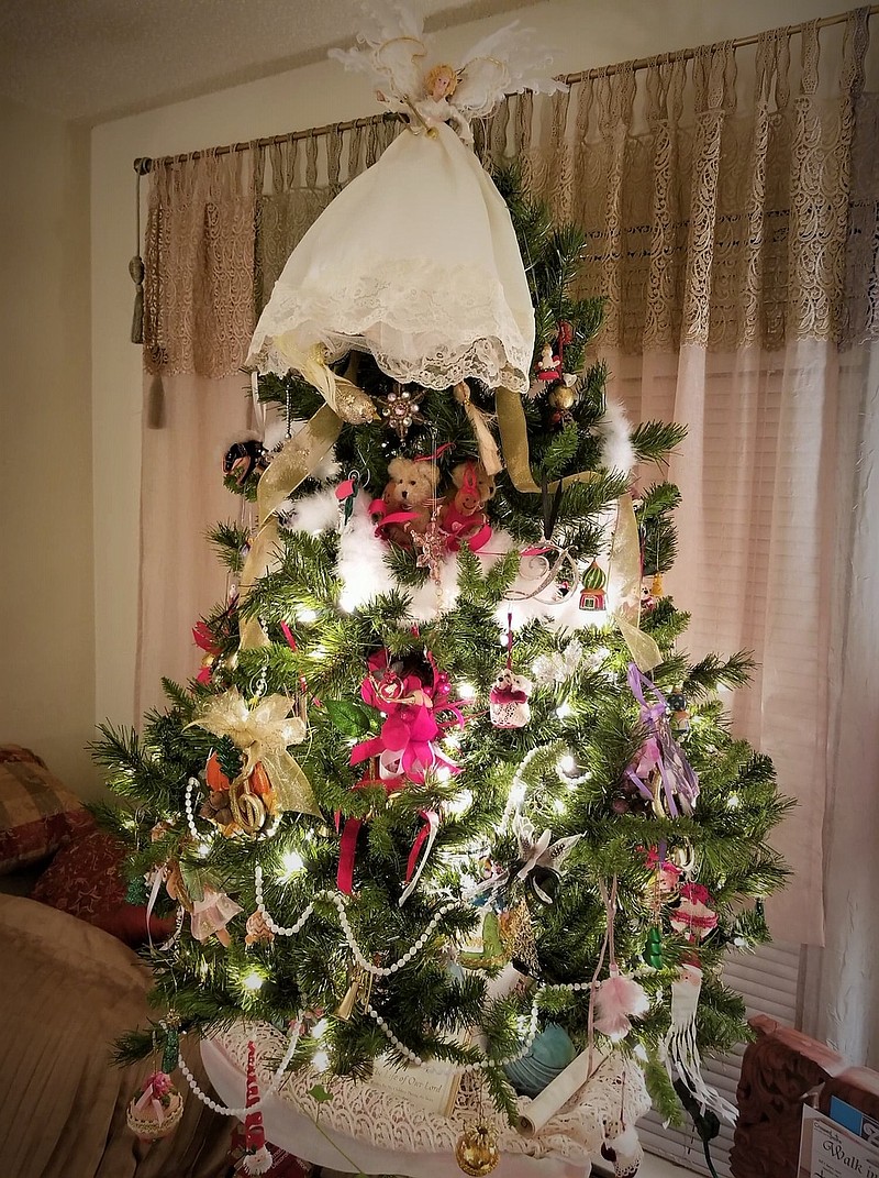 Contributed Photo by Daisy Pratt / Daisy Pratt put up three tabletop trees in her home four weeks ago as a way to infuse cheerfulness into her home quarantine during the pandemic. She made the angel tree-topper as well as all the ornaments. The angel's wings are made of feathers from a Sebastopol goose.