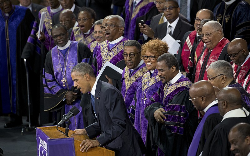 New York Times file photo by Stephen Crowley / President Barack Obama sings the hymn "Amazing Grace" with attendees after his June 26, 2015, eulogy for the Rev. Clementa Pinckney in Charleston, South Carolina. Obama had known Pinckney — the state senator and pastor shot dead along with eight other black churchgoers days earlier.