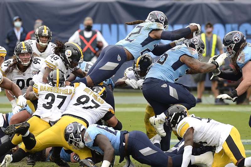 AP photo by Mark Zaleski / Tennessee Titans running back Derrick Henry dives over the goal line for a touchdown against the Pittsburgh Steelers in the second half of Sunday's game in Nashville.