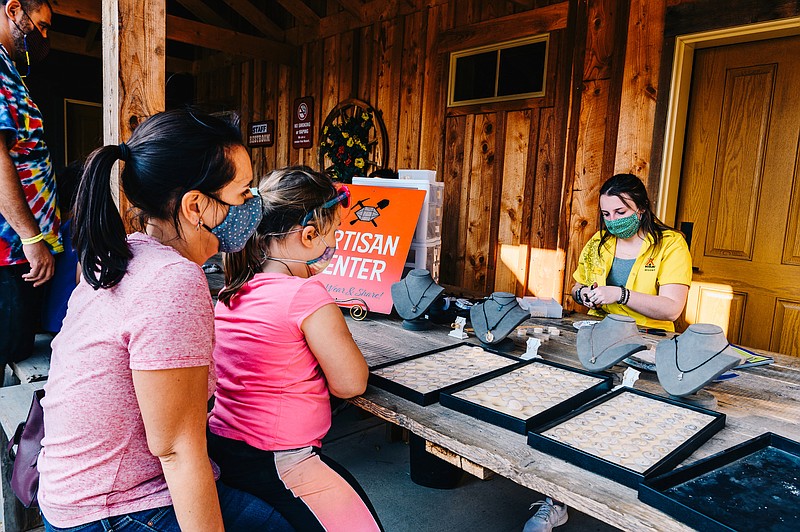 Visitors at the Herkimer Diamond Mines Artisan Center, in Herkimer, N.Y., Oct. 10, 2020, where they can have their quartz crystal finds made into jewelry. Some modern-day prospectors make thousands of dollars selling precious stones they dug up themselves At pay-to-dig mines around the U.S. (Nina Westervelt/The New York Times)